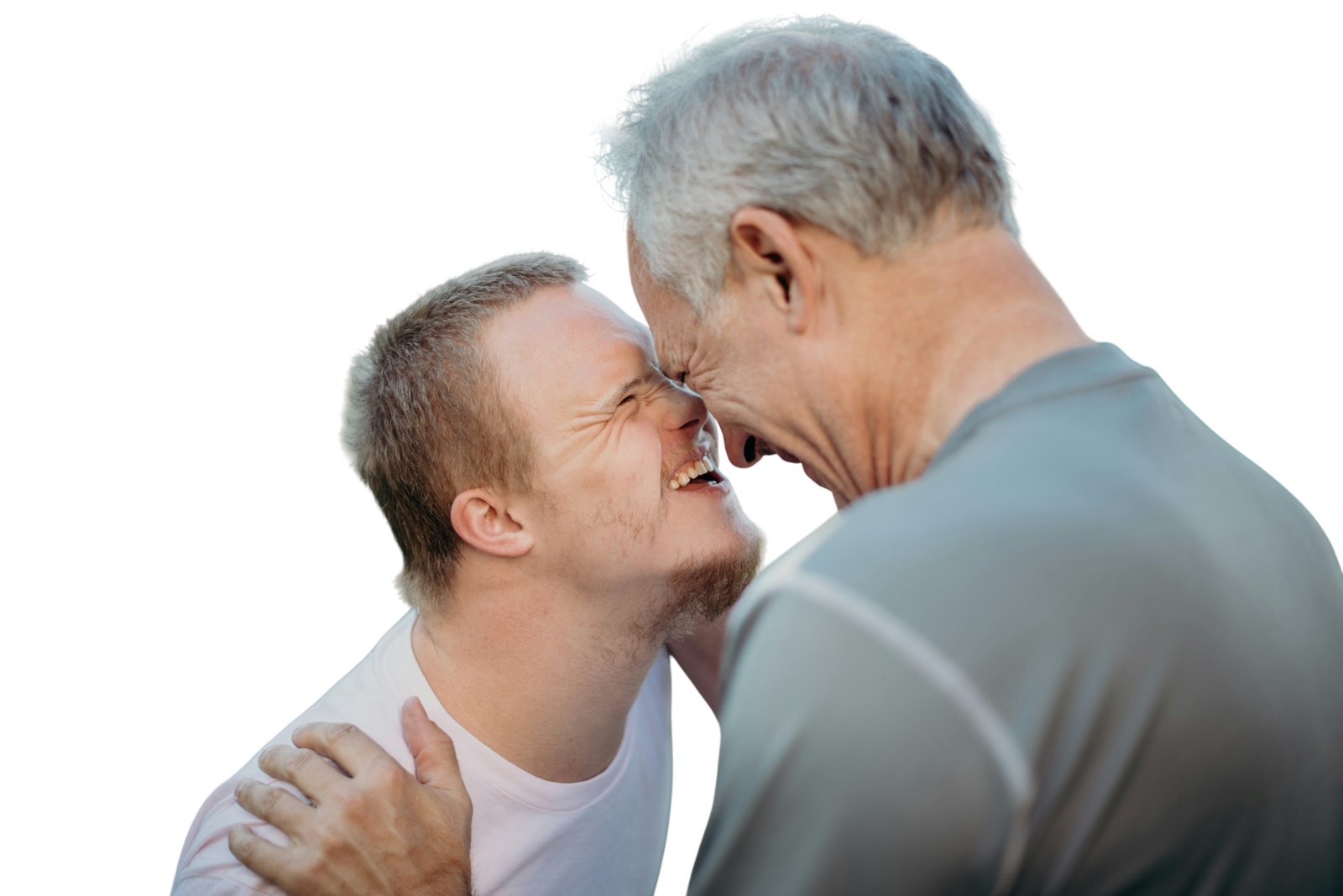 Older man sharing a joyful moment with an adult with disability